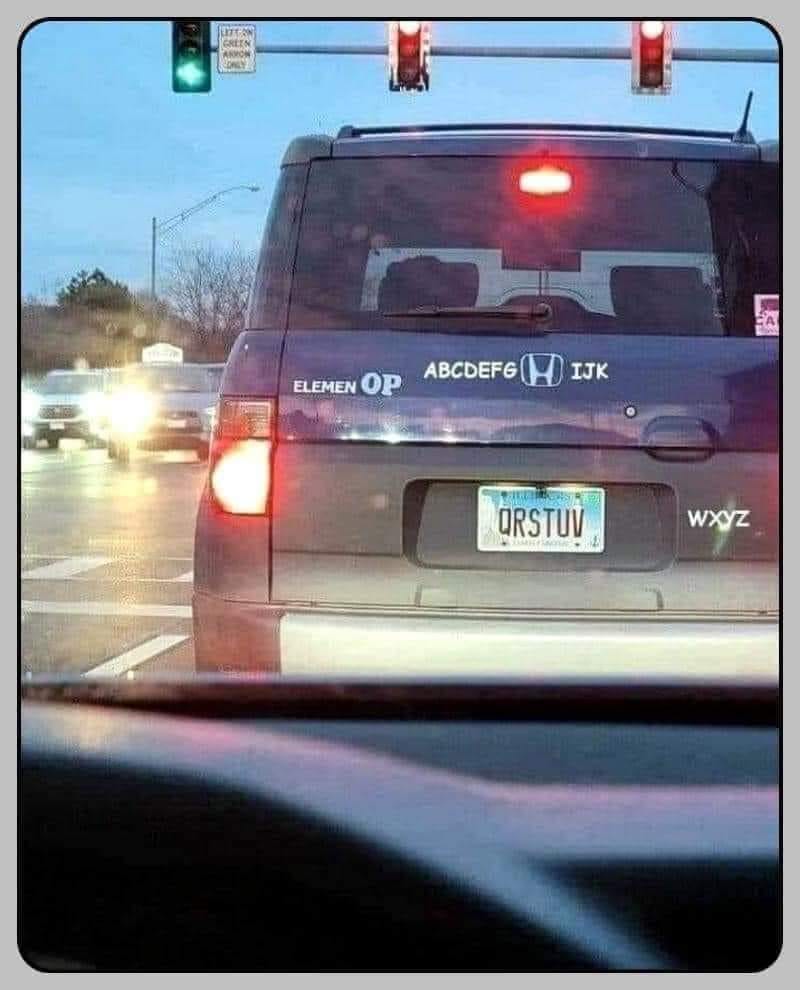 The meme is a photo of a car with a license plate that reads "QWERTYUIOP" and a bumper sticker that says "ELEVEN". The image is humorous because it's a play on the idea of a car being a vehicle for typing, with the license plate and bumper sticker being a clever reference to the keyboard layout.